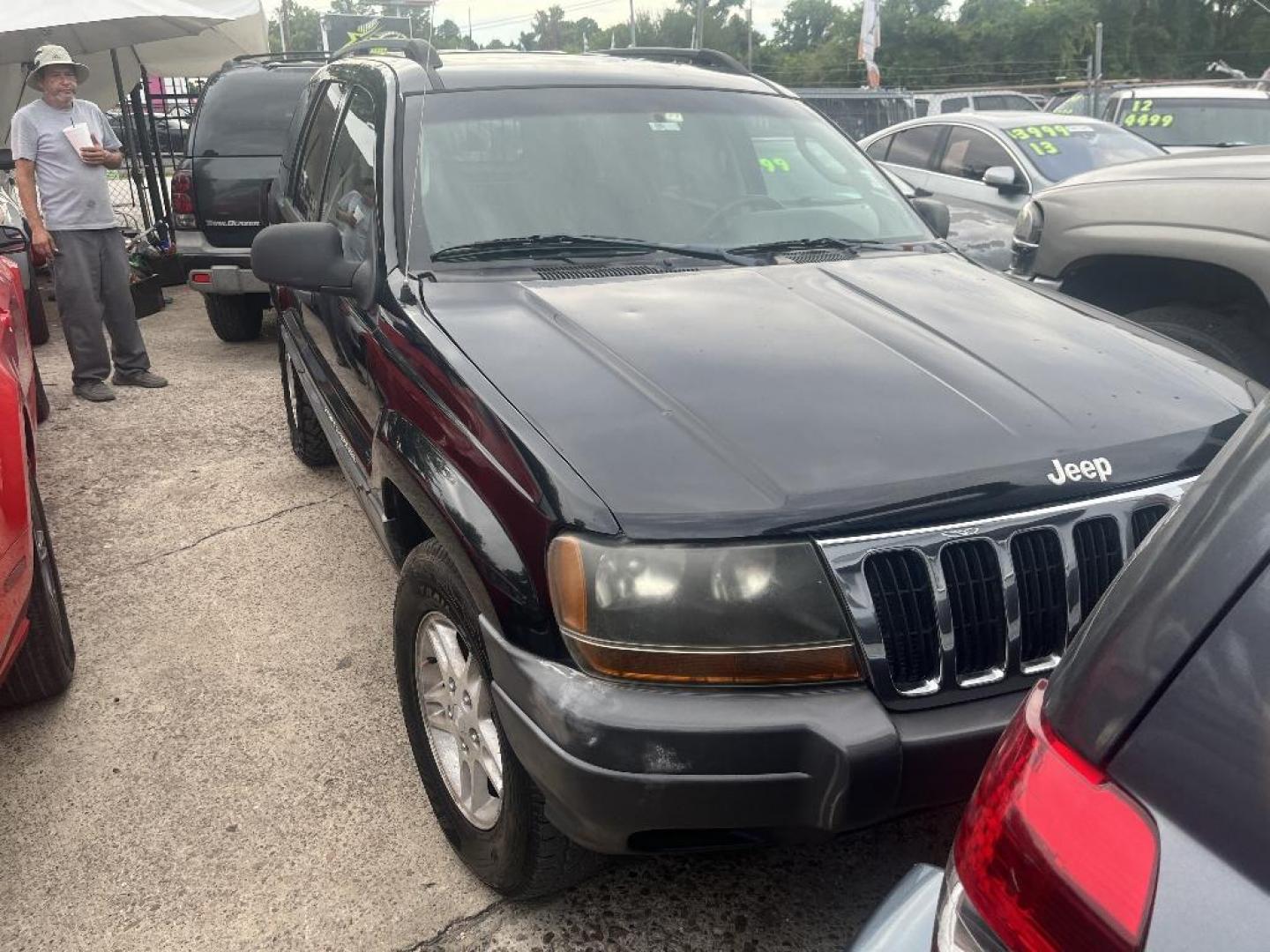 2002 BLACK JEEP GRAND CHEROKEE Laredo 2WD (1J4GX48S22C) with an 4.0L L6 OHV 12V engine, AUTOMATIC transmission, located at 2303 West Mt. Houston, Houston, 77038, (281) 507-3956, 29.771597, -95.339569 - Photo#5