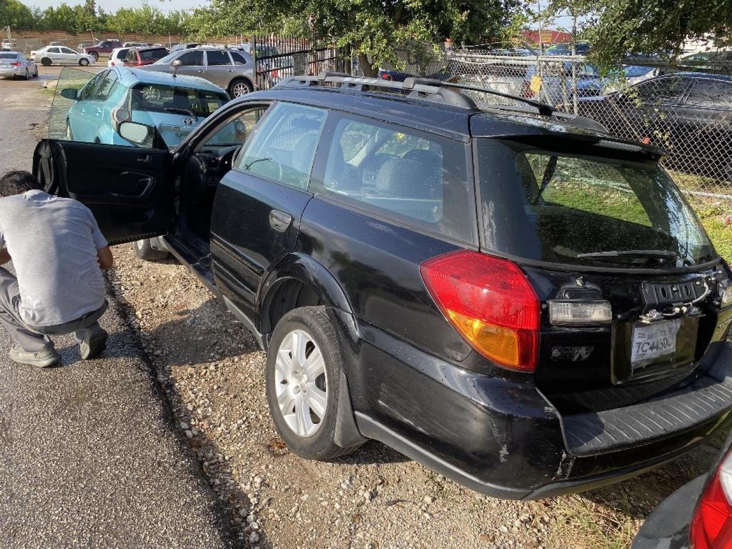 2005 BLACK SUBARU OUTBACK 2.5i Wagon (4S4BP61C757) with an 2.5L H4 SOHC 16V engine, AUTOMATIC transmission, located at 2303 West Mt. Houston, Houston, 77038, (281) 507-3956, 29.771597, -95.339569 - Photo#2