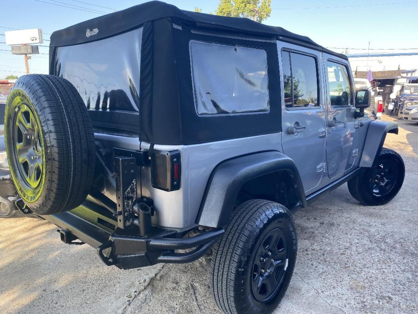 2014 BLACK JEEP WRANGLER Unlimited Sport 4WD (1C4HJWDGXEL) with an 3.6L V6 DOHC 24V FFV engine, AUTOMATIC transmission, located at 2303 West Mt. Houston, Houston, 77038, (281) 507-3956, 29.771597, -95.339569 - Photo#1