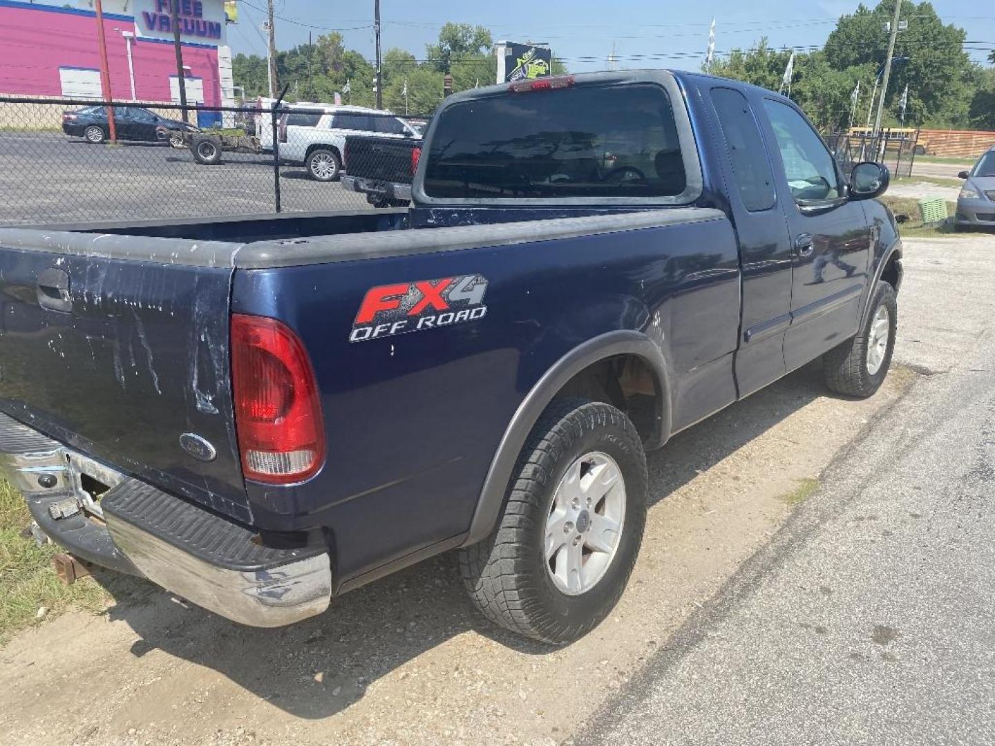 2002 BLUE FORD F-150 XL SuperCab Short Bed 4WD (1FTRX18L62K) with an 5.4L V8 SOHC 16V engine, AUTOMATIC transmission, located at 2303 West Mt. Houston, Houston, 77038, (281) 507-3956, 29.771597, -95.339569 - Photo#1