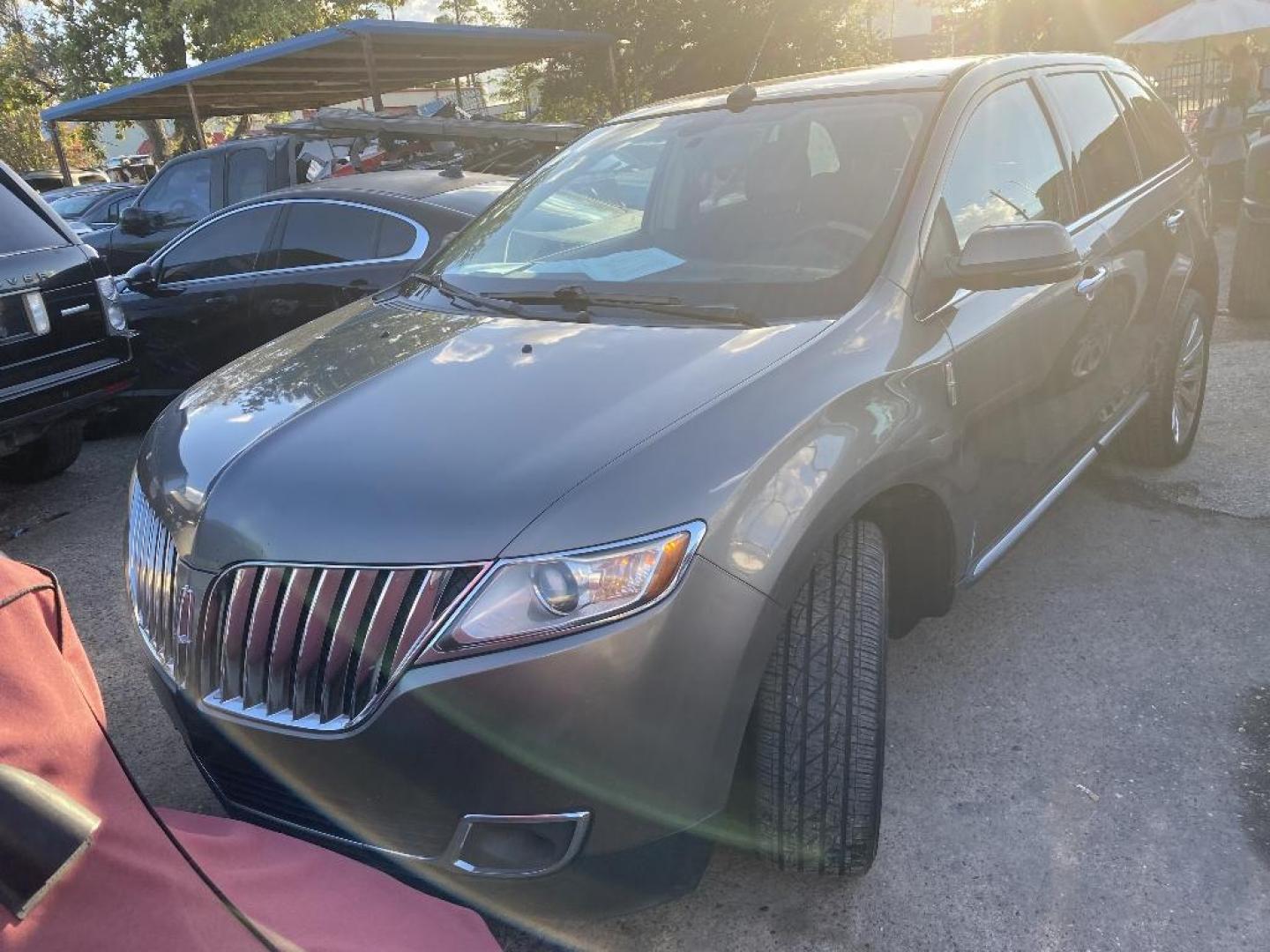 2012 BROWN LINCOLN MKX AWD (2LMDJ8JK0CB) with an 3.7L V6 DOHC 24V engine, AUTOMATIC transmission, located at 2303 West Mt. Houston, Houston, 77038, (281) 507-3956, 29.771597, -95.339569 - Photo#0