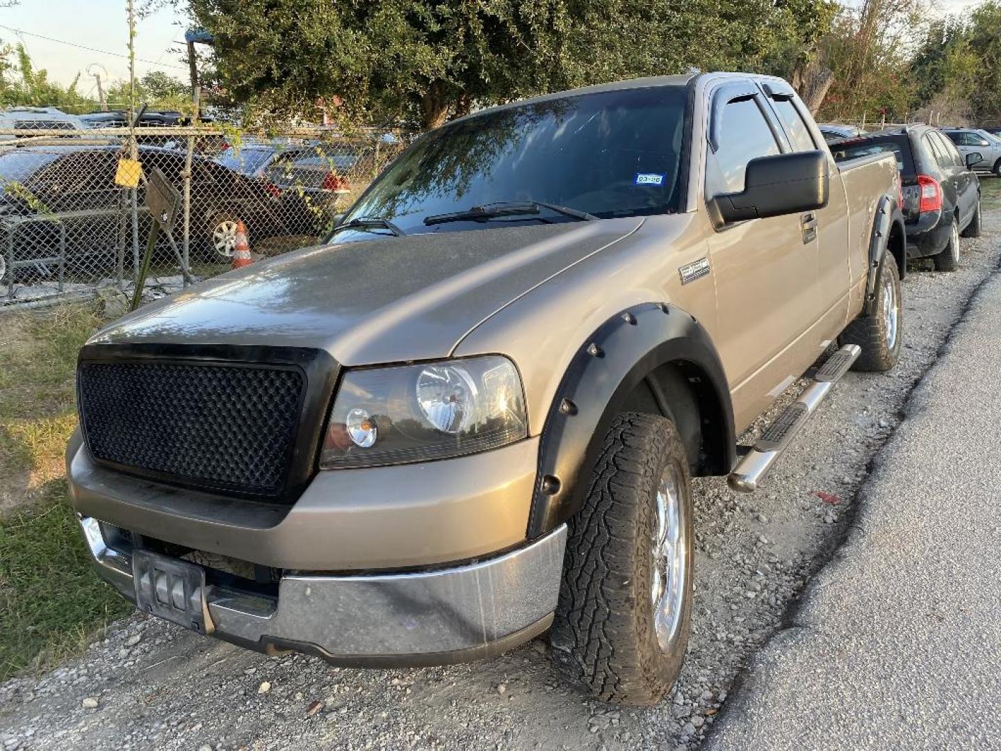 2004 BROWN FORD F-150 XLT SuperCab 5.5-ft Box 2WD (1FTPX12594N) with an 5.4L V8 SOHC 16V engine, AUTOMATIC transmission, located at 2303 West Mt. Houston, Houston, 77038, (281) 507-3956, 29.771597, -95.339569 - Photo#0