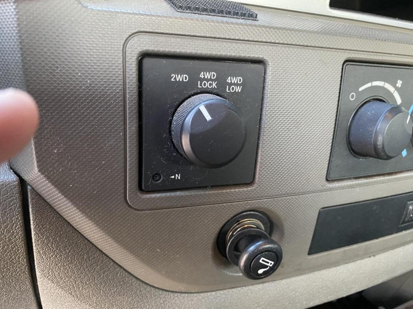 2008 RED DODGE RAM 1500 Laramie Quad Cab 4WD (1D7HU18218S) with an 5.7L V8 OHV 16V engine, AUTOMATIC transmission, located at 2303 West Mt. Houston, Houston, 77038, (281) 507-3956, 29.771597, -95.339569 - Photo#2