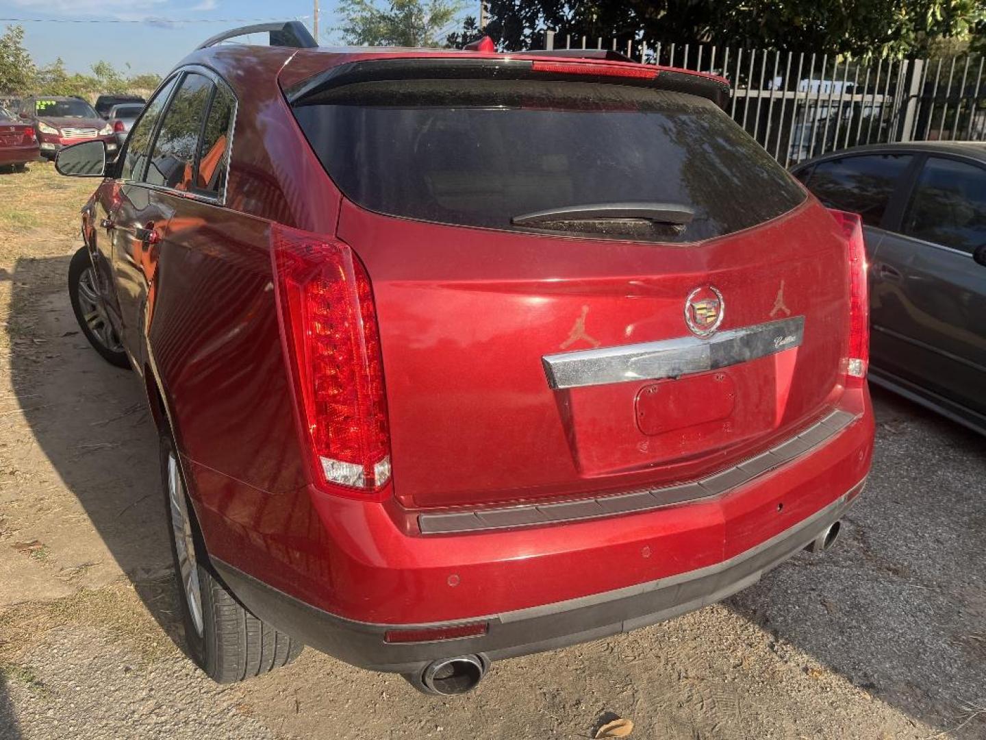 2010 RED CADILLAC SRX Luxury Collection (3GYFNAEY8AS) with an 3.0L V6 DOHC 24V engine, AUTOMATIC transmission, located at 2303 West Mt. Houston, Houston, 77038, (281) 507-3956, 29.771597, -95.339569 - Photo#1