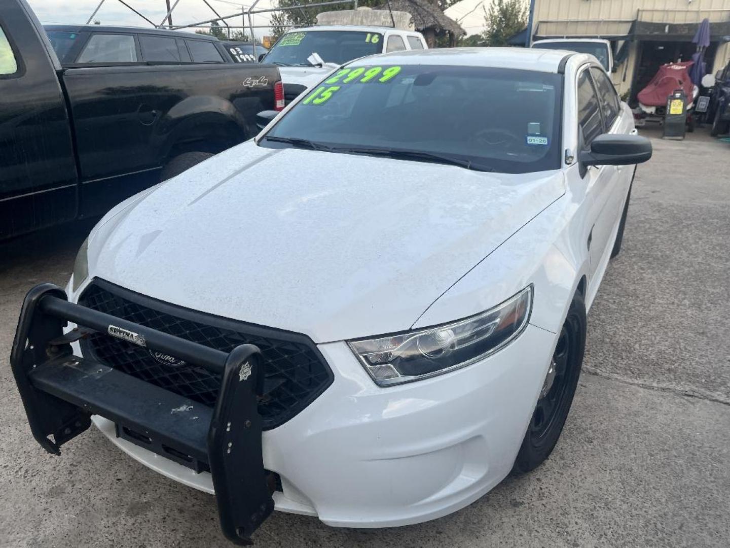 2015 WHITE FORD TAURUS Police AWD (1FAHP2MK7FG) with an 3.7L V6 DOHC 24V engine, AUTOMATIC transmission, located at 2303 West Mt. Houston, Houston, 77038, (281) 507-3956, 29.771597, -95.339569 - Photo#0