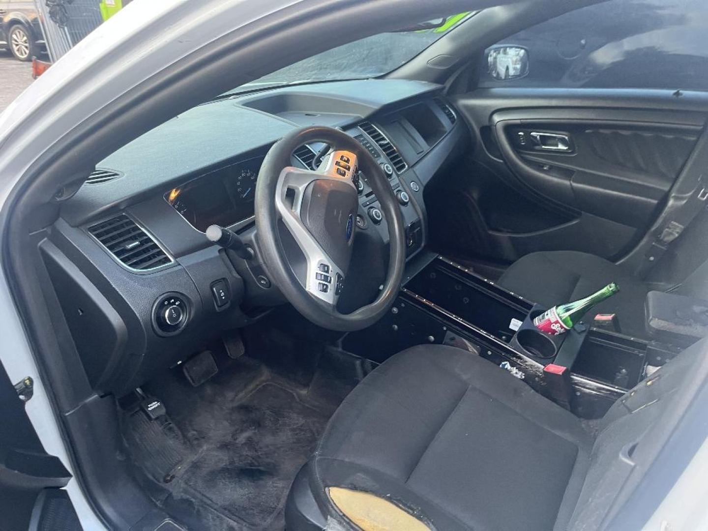 2015 WHITE FORD TAURUS Police AWD (1FAHP2MK7FG) with an 3.7L V6 DOHC 24V engine, AUTOMATIC transmission, located at 2303 West Mt. Houston, Houston, 77038, (281) 507-3956, 29.771597, -95.339569 - Photo#2