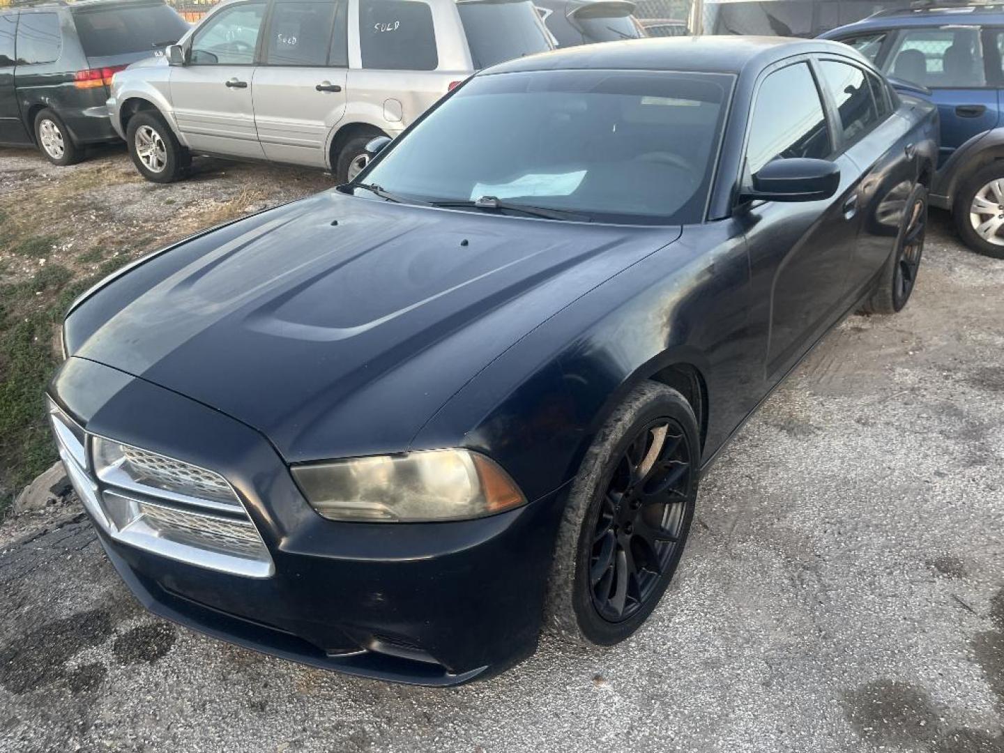 2012 BLACK DODGE CHARGER SE (2C3CDXBG4CH) with an 3.6L V6 DOHC 24V engine, AUTOMATIC transmission, located at 2303 West Mt. Houston, Houston, 77038, (281) 507-3956, 29.771597, -95.339569 - Photo#1