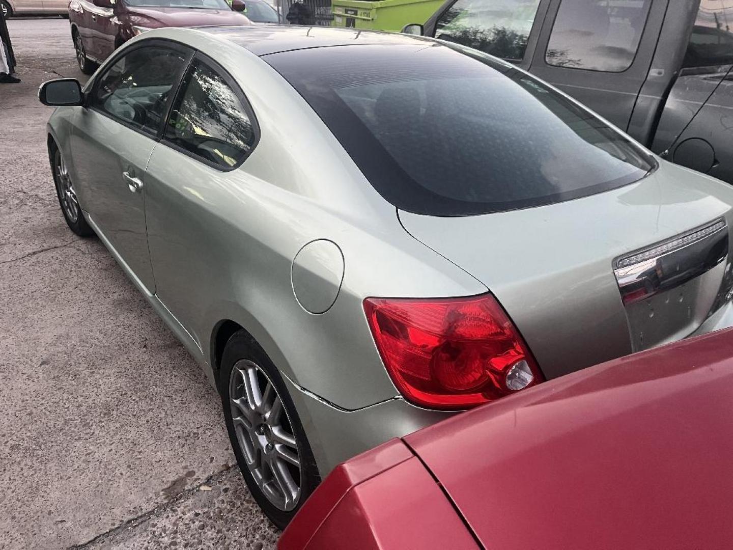 2005 GREEN TOYOTA SION Sport Coupe (JTKDE177550) with an 2.4L L4 DOHC 16V engine, AUTOMATIC transmission, located at 2303 West Mt. Houston, Houston, 77038, (281) 507-3956, 29.771597, -95.339569 - Photo#3