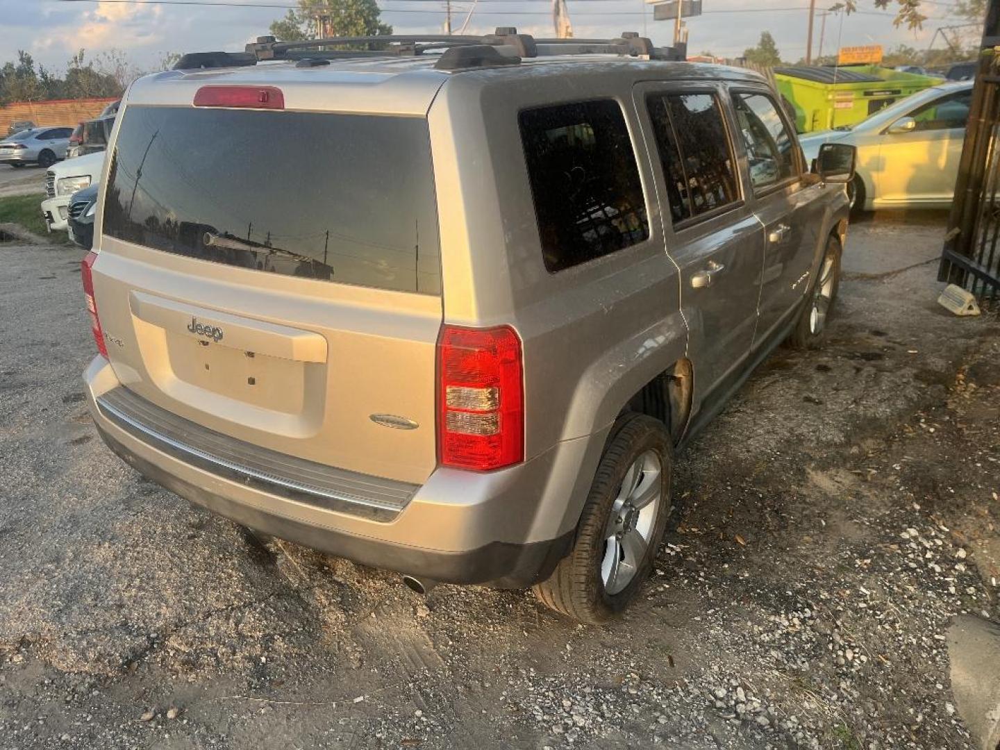 2011 GRAY JEEP PATRIOT Latitude X 4WD (1J4NF4GB2BD) with an 2.4L L4 DOHC 16V engine, AUTOMATIC transmission, located at 2303 West Mt. Houston, Houston, 77038, (281) 507-3956, 29.771597, -95.339569 - Photo#2