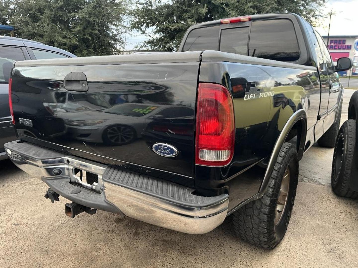 2003 BLACK FORD F-150 XL SuperCab 4WD (2FTRX18L23C) with an 5.4L V8 SOHC 16V engine, AUTOMATIC transmission, located at 2303 West Mt. Houston, Houston, 77038, (281) 507-3956, 29.771597, -95.339569 - Photo#1