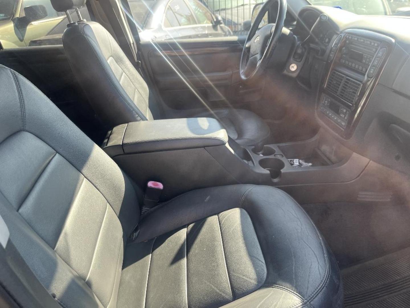 2004 BLACK FORD EXPLORER Limited 4.6L 4WD (1FMDU75W04Z) with an 4.6L V8 SOHC 16V engine, AUTOMATIC transmission, located at 2303 West Mt. Houston, Houston, 77038, (281) 507-3956, 29.771597, -95.339569 - Photo#2