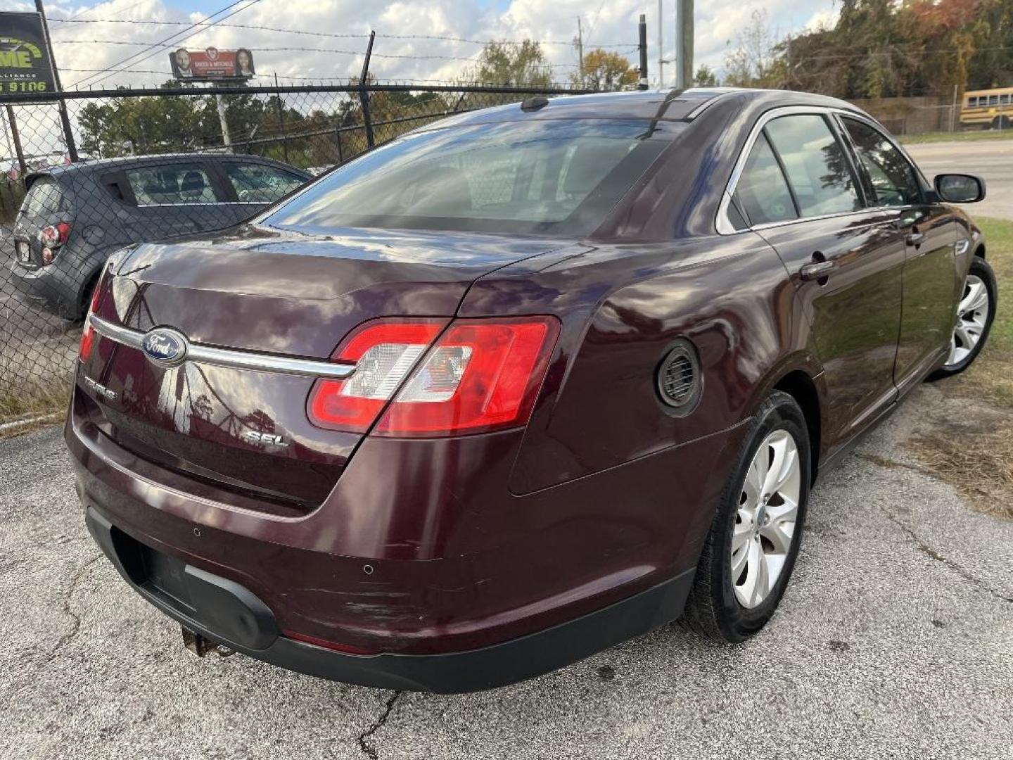 2011 MAROON FORD TAURUS SEL FWD (1FAHP2EW6BG) with an 3.5L V6 DOHC 24V engine, AUTOMATIC transmission, located at 2303 West Mt. Houston, Houston, 77038, (281) 507-3956, 29.771597, -95.339569 - Photo#1