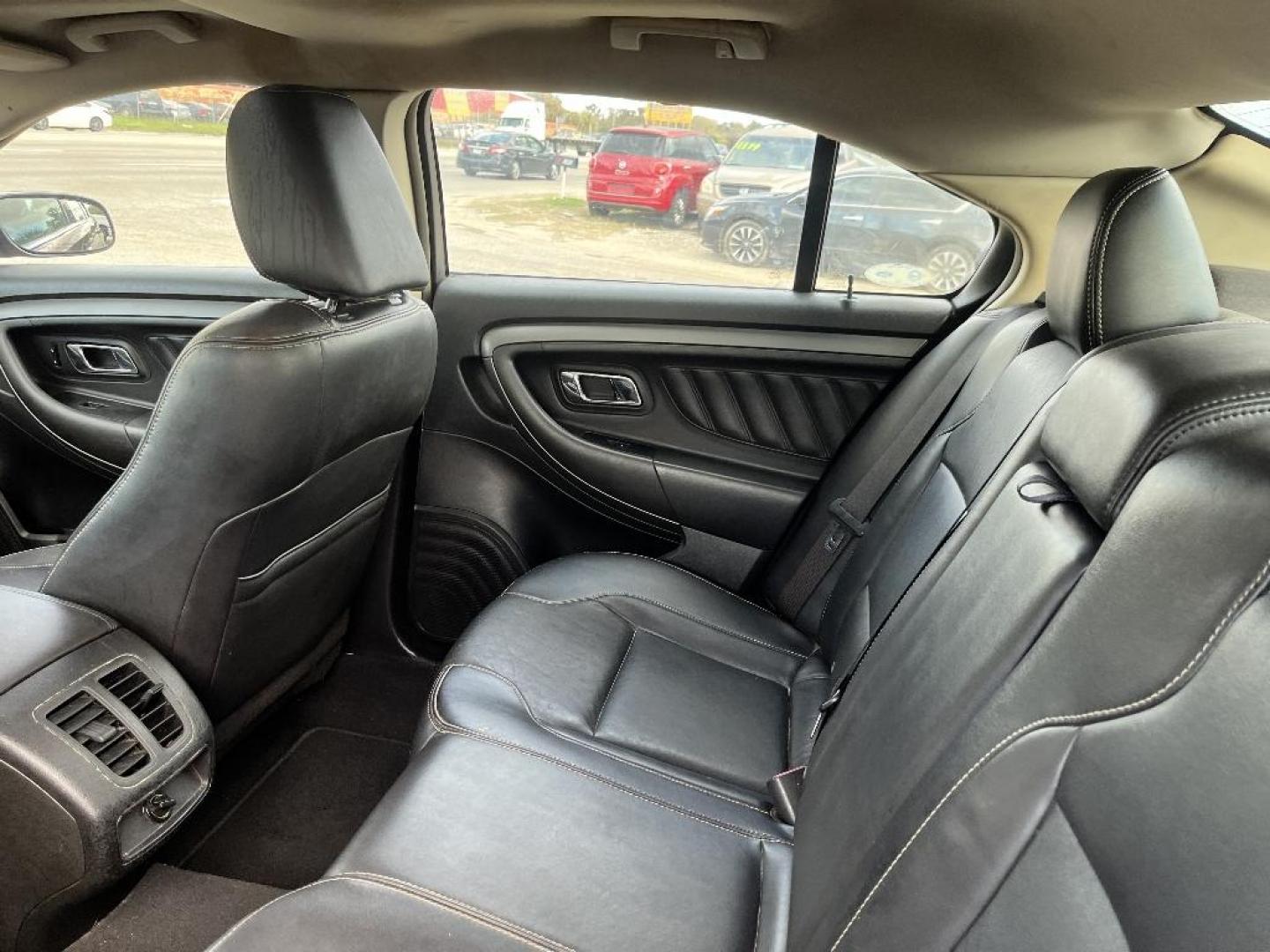 2011 MAROON FORD TAURUS SEL FWD (1FAHP2EW6BG) with an 3.5L V6 DOHC 24V engine, AUTOMATIC transmission, located at 2303 West Mt. Houston, Houston, 77038, (281) 507-3956, 29.771597, -95.339569 - Photo#3