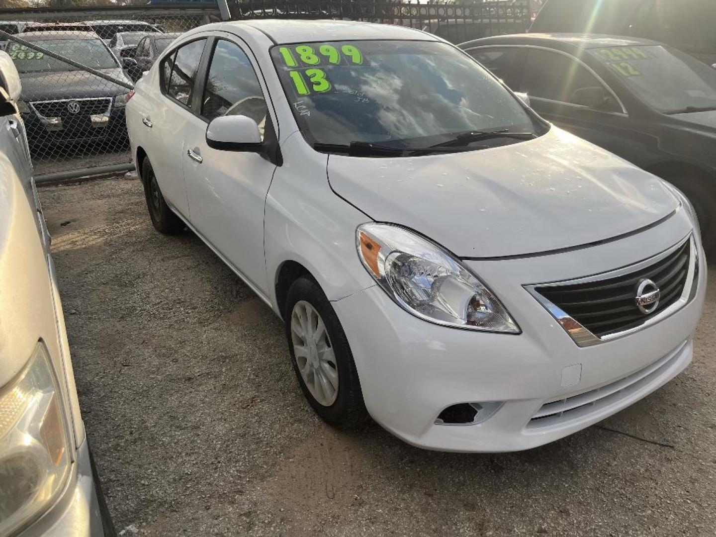 2013 WHITE NISSAN VERSA 1.6 S 5M (3N1CN7AP4DL) with an 1.6L L4 DOHC 16V engine, AUTOMATIC transmission, located at 2303 West Mt. Houston, Houston, 77038, (281) 507-3956, 29.771597, -95.339569 - Photo#0