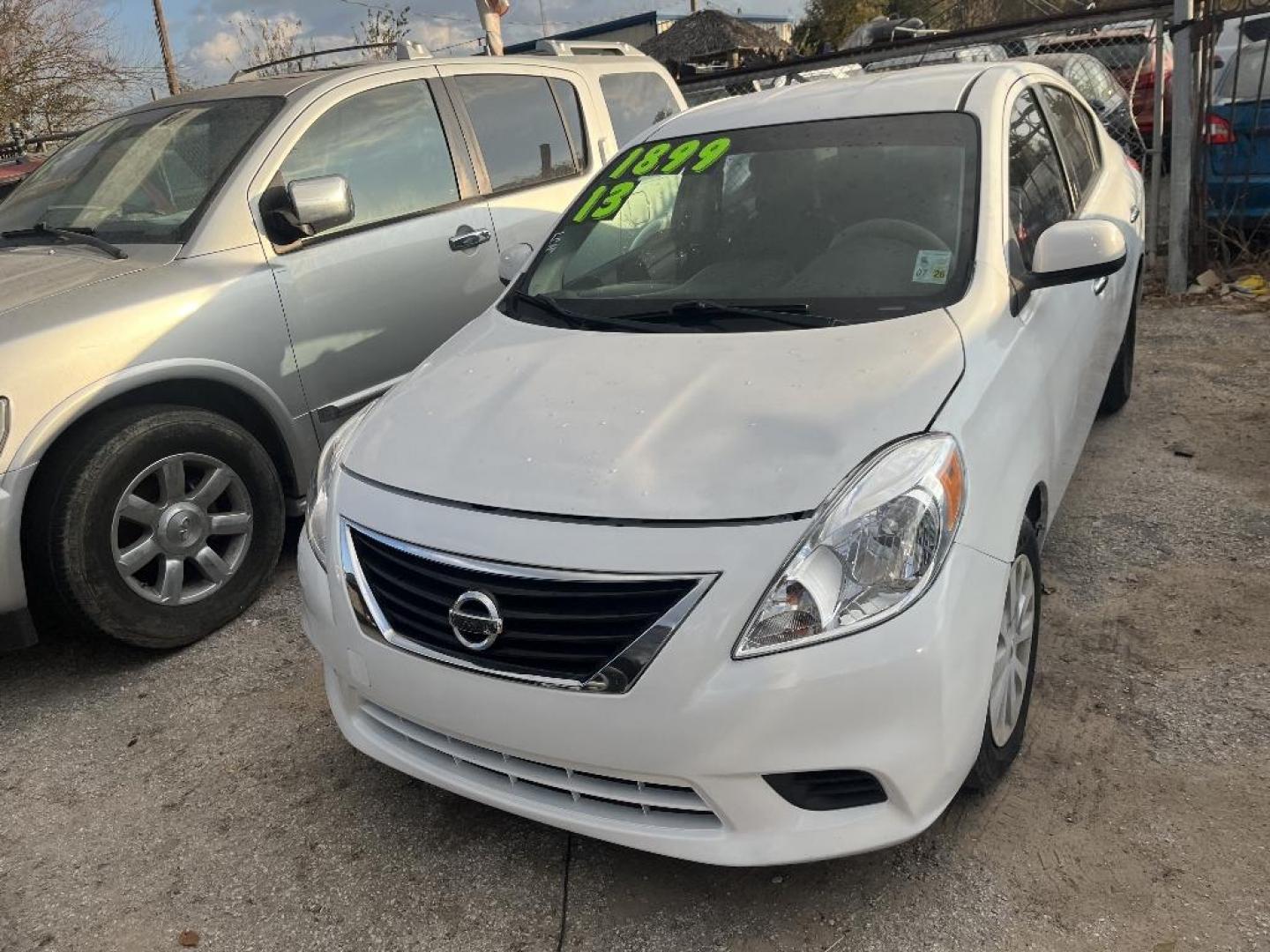 2013 WHITE NISSAN VERSA 1.6 S 5M (3N1CN7AP4DL) with an 1.6L L4 DOHC 16V engine, AUTOMATIC transmission, located at 2303 West Mt. Houston, Houston, 77038, (281) 507-3956, 29.771597, -95.339569 - Photo#1