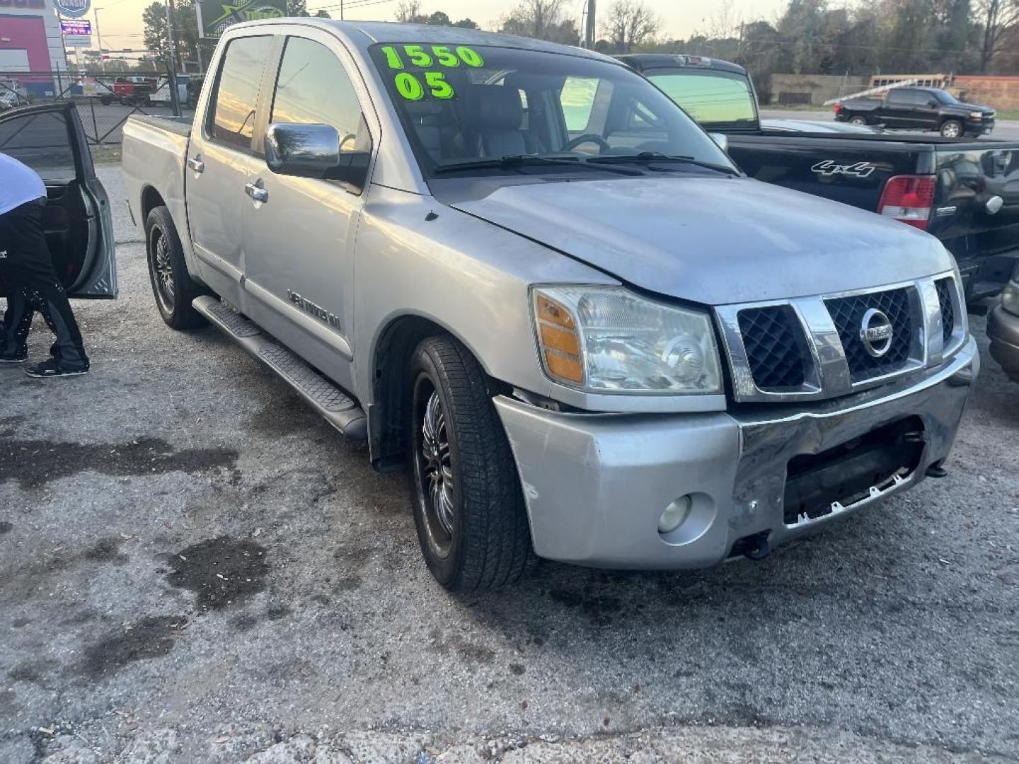 2005 GRAY NISSAN TITAN XE Crew Cab 2WD (1N6BA07A95N) with an 5.6L V8 DOHC 32V FFV engine, AUTOMATIC transmission, located at 2303 West Mt. Houston, Houston, 77038, (281) 507-3956, 29.771597, -95.339569 - Photo#0