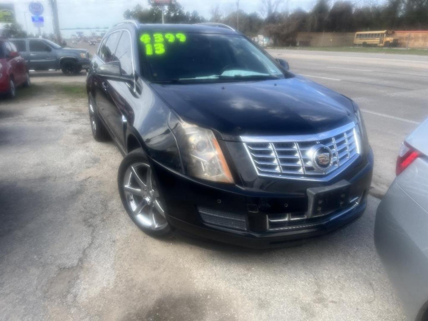 2013 BLACK CADILLAC SRX Luxury Collection (3GYFNCE34DS) with an 3.6L V6 DOHC 24V FFV engine, AUTOMATIC transmission, located at 2303 West Mt. Houston, Houston, 77038, (281) 507-3956, 29.771597, -95.339569 - Photo#1