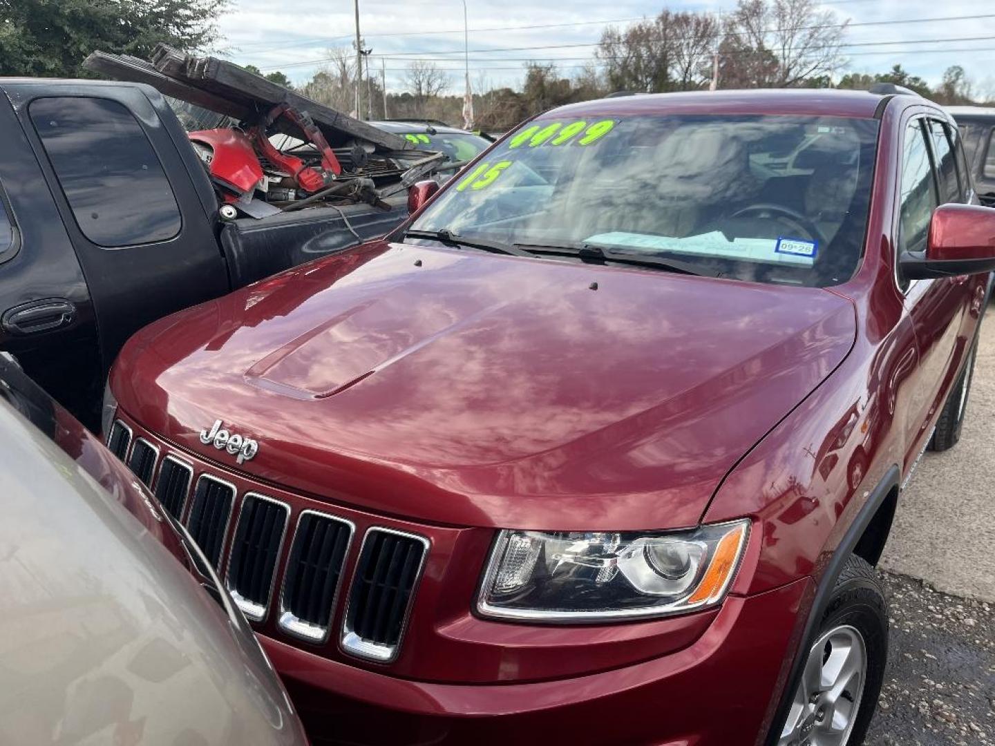 2015 RED JEEP GRAND CHEROKEE Laredo 2WD (1C4RJEAG5FC) with an 3.6L V6 DOHC 24V engine, AUTOMATIC transmission, located at 2303 West Mt. Houston, Houston, 77038, (281) 507-3956, 29.771597, -95.339569 - Photo#0