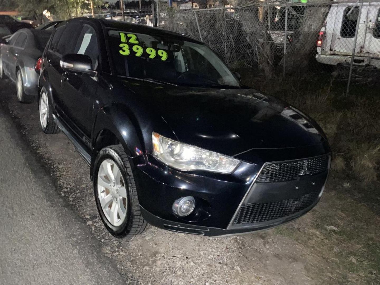 2012 BLACK MITSUBISHI OUTLANDER SE 2WD (JA4JS4AXXCU) with an 3.0L V6 SOHC 24V engine, AUTOMATIC transmission, located at 2303 West Mt. Houston, Houston, 77038, (281) 507-3956, 29.771597, -95.339569 - Photo#2