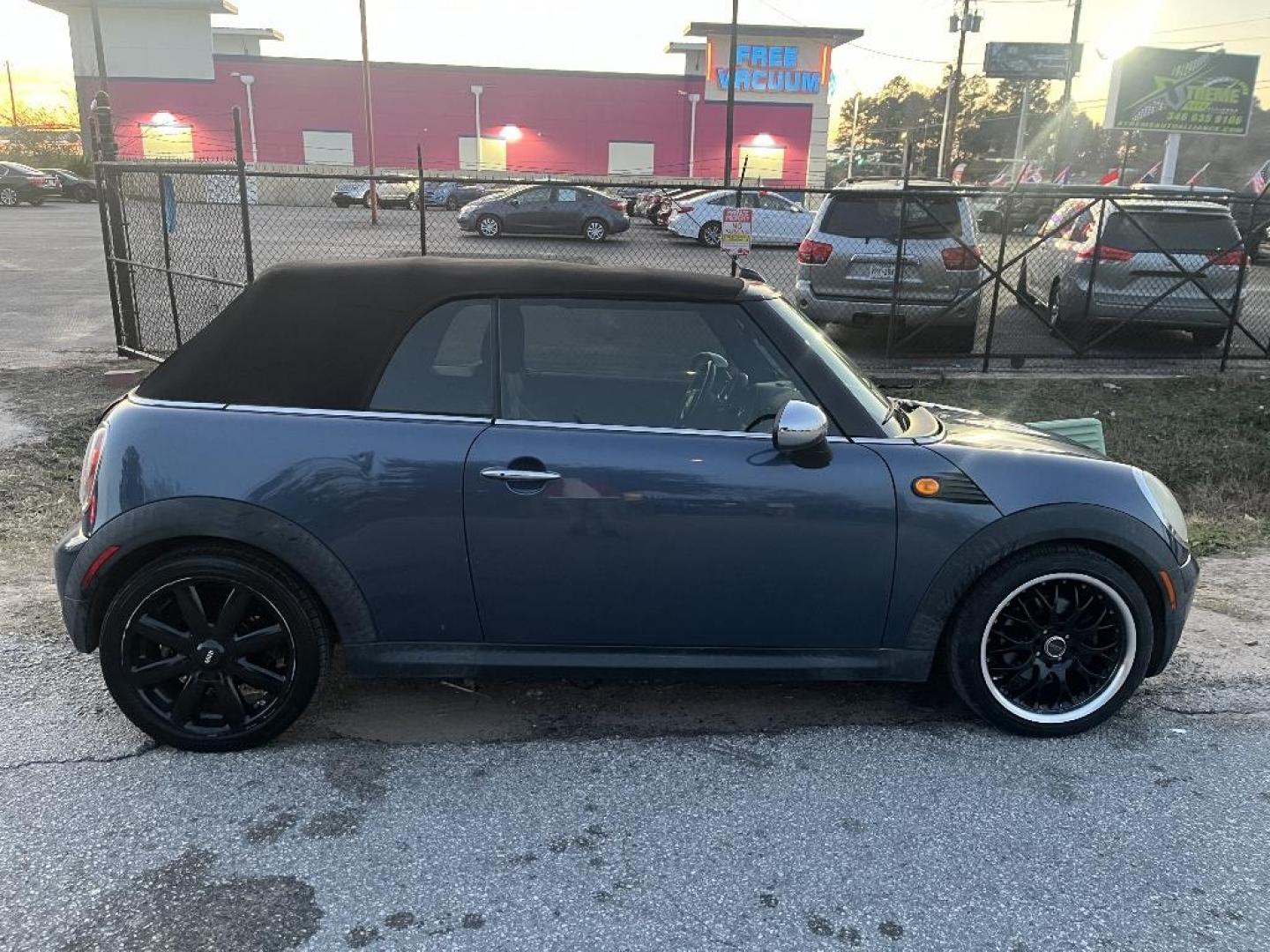 2009 BLUE MINI COOPER Convertible (WMWMR33569T) with an 1.6L L4 DOHC 16V engine, AUTOMATIC transmission, located at 2303 West Mt. Houston, Houston, 77038, (281) 507-3956, 29.771597, -95.339569 - Photo#1
