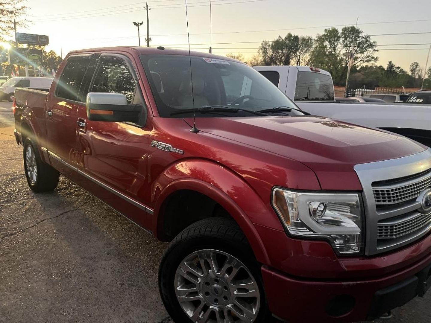 2010 RED FORD F-150 Lariat SuperCrew 5.5-ft. Bed 4WD (1FTFW1EV6AF) with an 5.4L V8 SOHC 24V FFV engine, AUTOMATIC transmission, located at 2303 West Mt. Houston, Houston, 77038, (281) 507-3956, 29.771597, -95.339569 - Photo#0