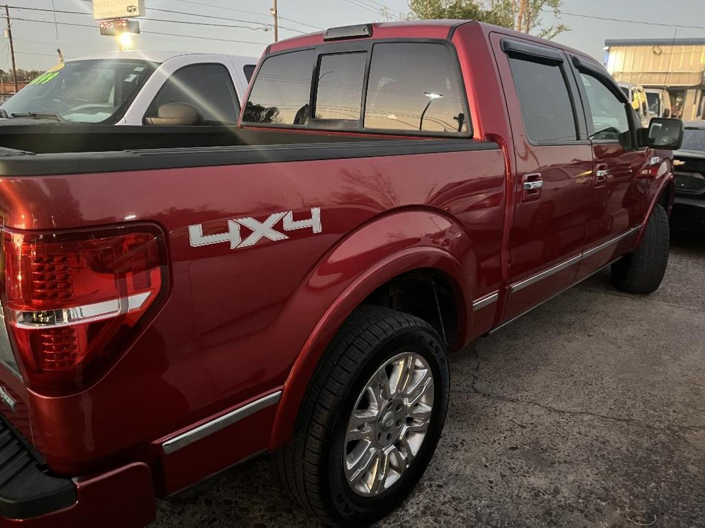 2010 RED FORD F-150 Lariat SuperCrew 5.5-ft. Bed 4WD (1FTFW1EV6AF) with an 5.4L V8 SOHC 24V FFV engine, AUTOMATIC transmission, located at 2303 West Mt. Houston, Houston, 77038, (281) 507-3956, 29.771597, -95.339569 - Photo#1