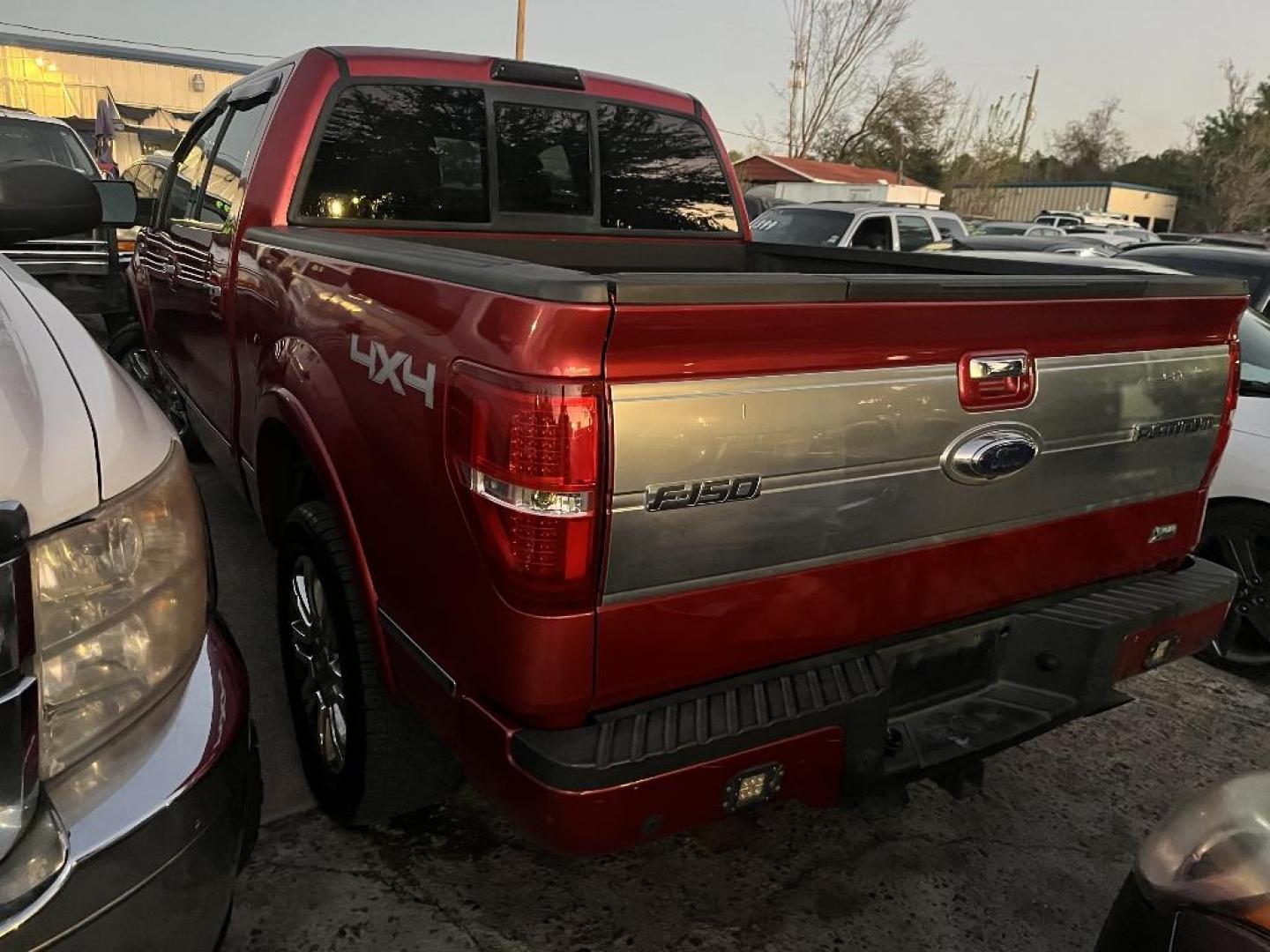2010 RED FORD F-150 Lariat SuperCrew 5.5-ft. Bed 4WD (1FTFW1EV6AF) with an 5.4L V8 SOHC 24V FFV engine, AUTOMATIC transmission, located at 2303 West Mt. Houston, Houston, 77038, (281) 507-3956, 29.771597, -95.339569 - Photo#2