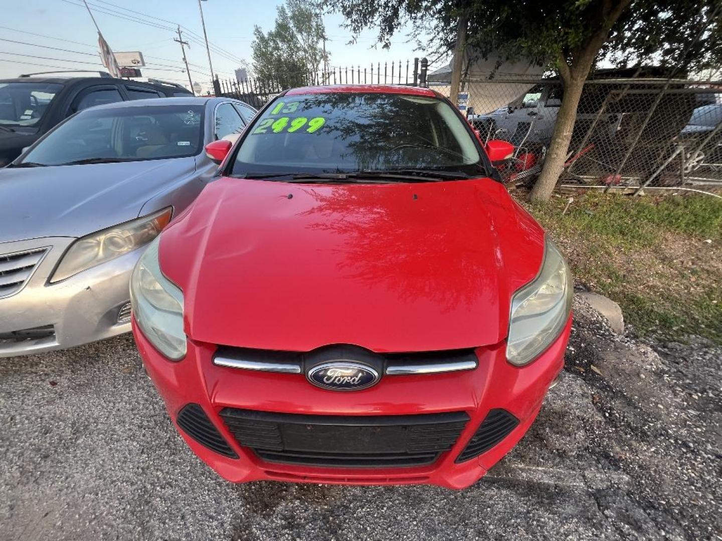 2013 RED FORD FOCUS SE Sedan (1FADP3F21DL) with an 2.0L L4 DOHC 16V engine, AUTOMATIC transmission, located at 2303 West Mt. Houston, Houston, 77038, (281) 507-3956, 29.771597, -95.339569 - Photo#0