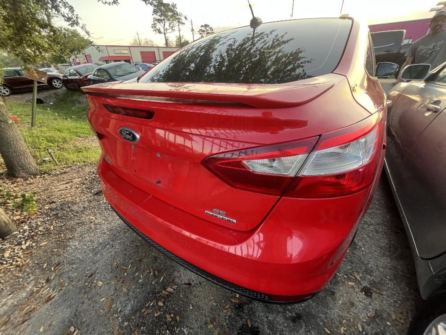 2013 RED FORD FOCUS SE Sedan (1FADP3F21DL) with an 2.0L L4 DOHC 16V engine, AUTOMATIC transmission, located at 2303 West Mt. Houston, Houston, 77038, (281) 507-3956, 29.771597, -95.339569 - Photo#1