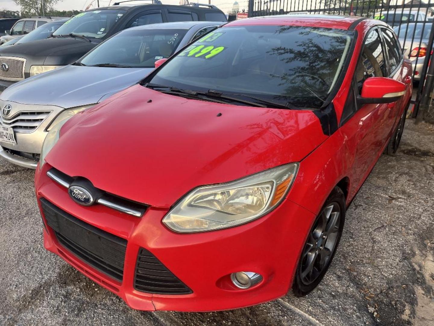 2013 RED FORD FOCUS SE Sedan (1FADP3F21DL) with an 2.0L L4 DOHC 16V engine, AUTOMATIC transmission, located at 2303 West Mt. Houston, Houston, 77038, (281) 507-3956, 29.771597, -95.339569 - Photo#3