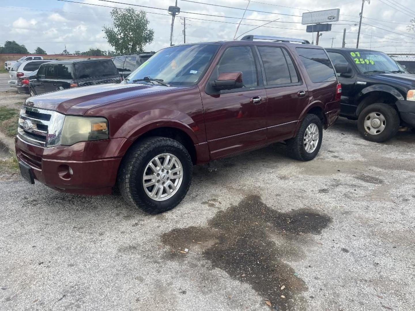 2012 RED FORD EXPEDITION Limited 2WD (1FMJU1K57CE) with an 5.4L V8 SOHC 16V FFV engine, AUTOMATIC transmission, located at 2303 West Mt. Houston, Houston, 77038, (281) 507-3956, 29.771597, -95.339569 - Photo#0