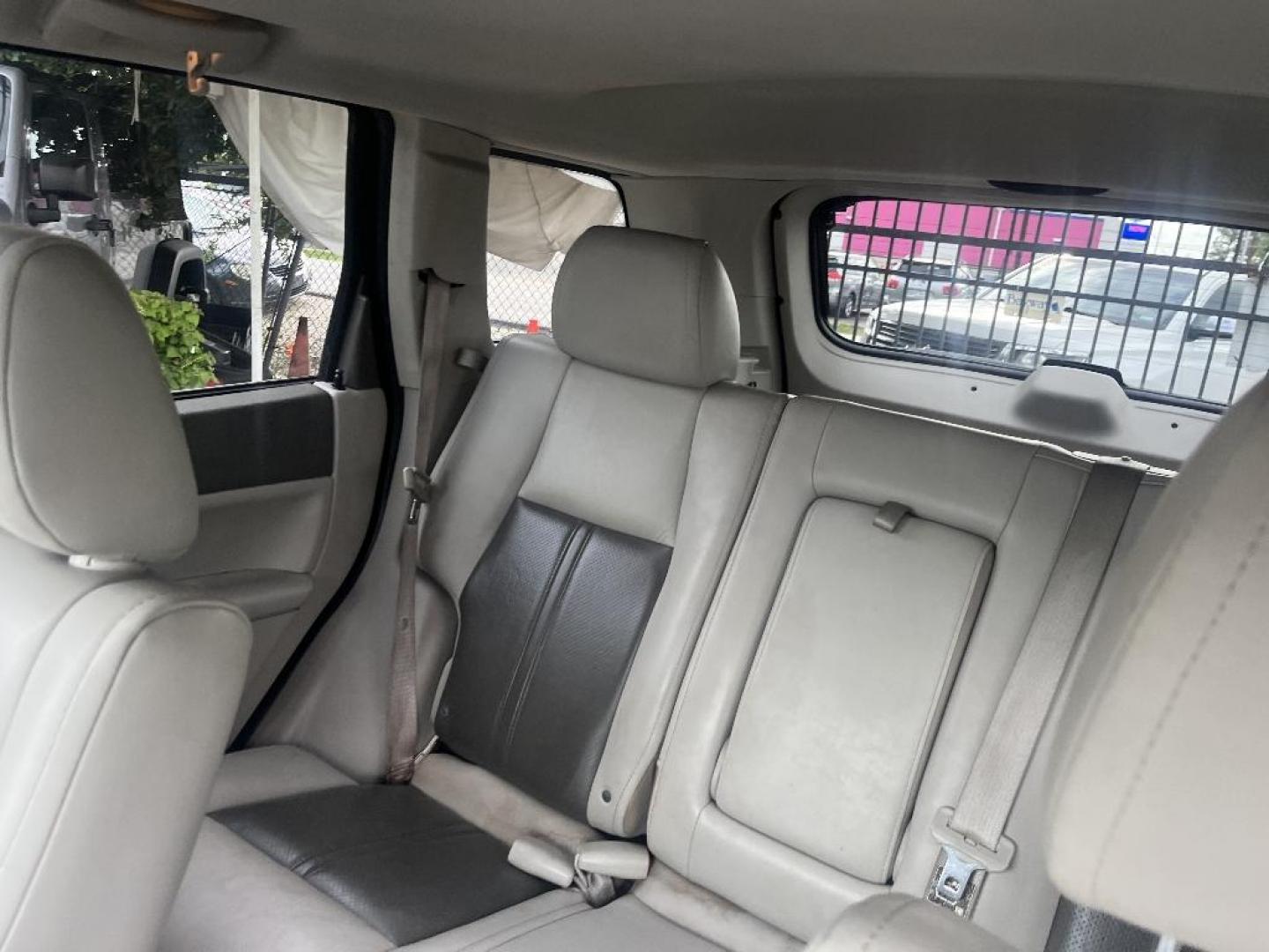 2007 BLACK JEEP GRAND CHEROKEE Limited 2WD (1J8HS58217C) with an 5.7L V8 OHV 16V engine, AUTOMATIC transmission, located at 2303 West Mt. Houston, Houston, 77038, (281) 507-3956, 29.771597, -95.339569 - Photo#3