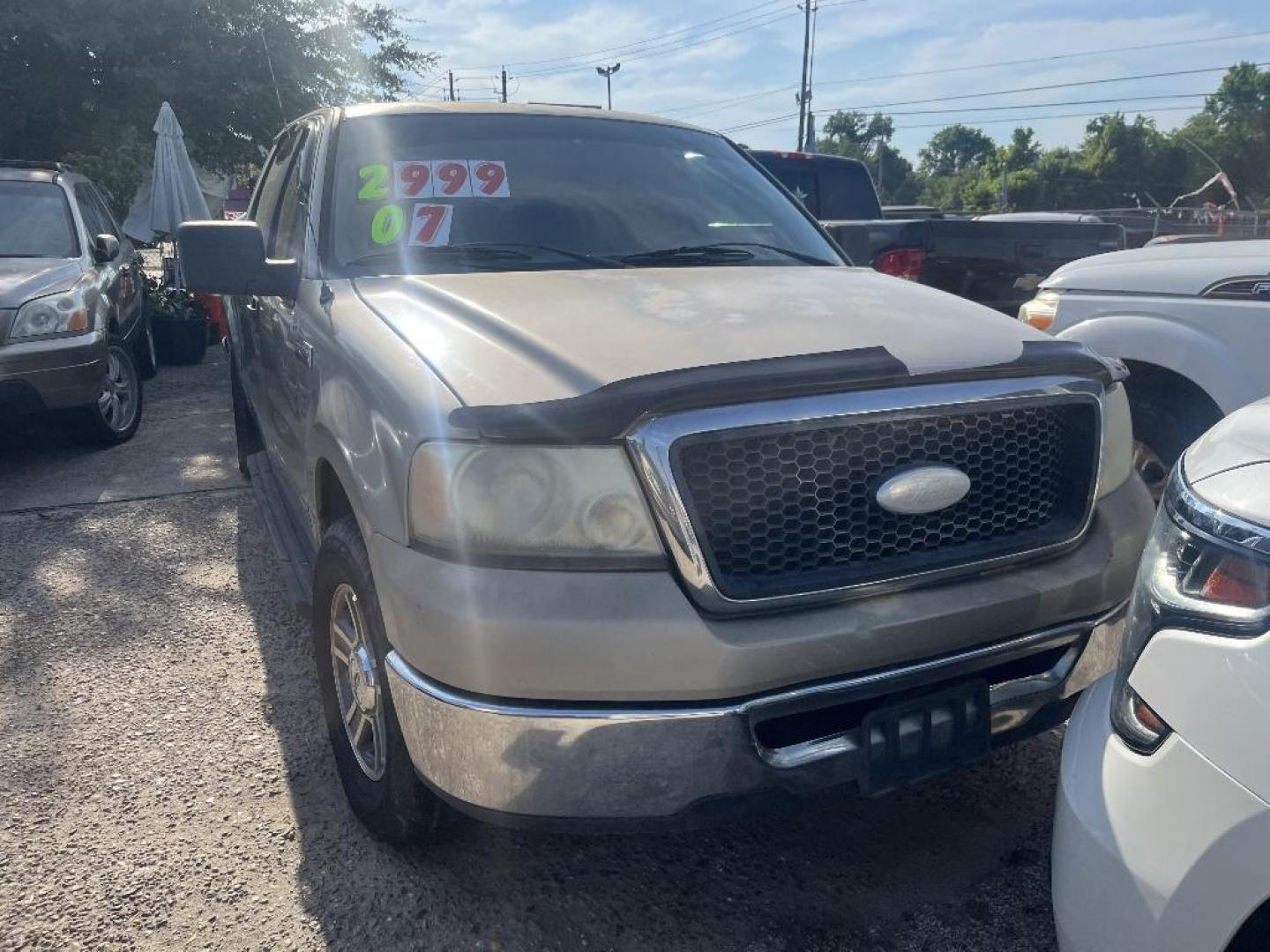 2007 BROWN FORD F-150 Lariat SuperCrew Short Box 2WD (1FTPW12V77F) with an 5.4L V8 SOHC 24V FFV engine, AUTOMATIC transmission, located at 2303 West Mt. Houston, Houston, 77038, (281) 507-3956, 29.771597, -95.339569 - Photo#0
