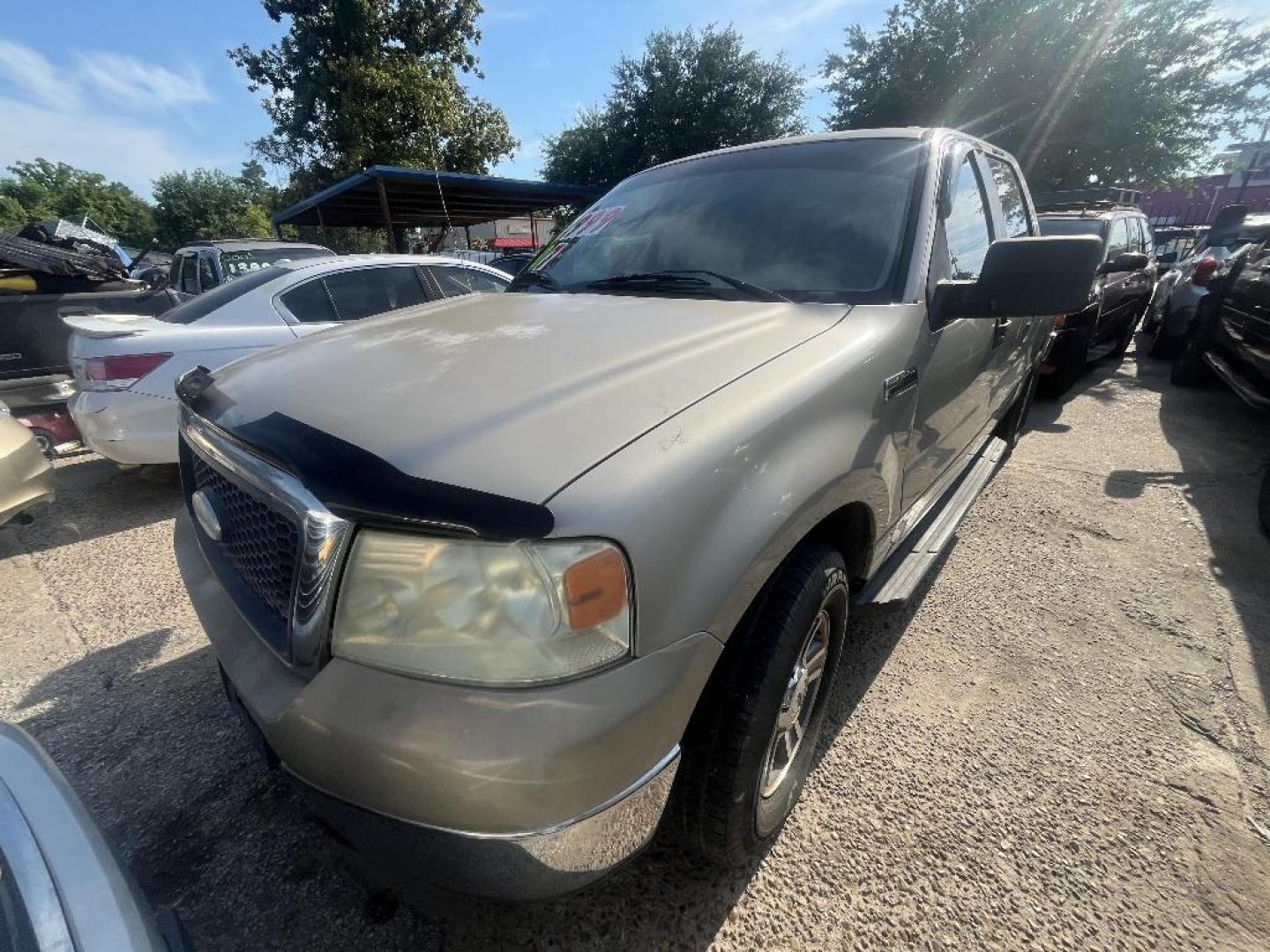 2007 BROWN FORD F-150 Lariat SuperCrew Short Box 2WD (1FTPW12V77F) with an 5.4L V8 SOHC 24V FFV engine, AUTOMATIC transmission, located at 2303 West Mt. Houston, Houston, 77038, (281) 507-3956, 29.771597, -95.339569 - Photo#2