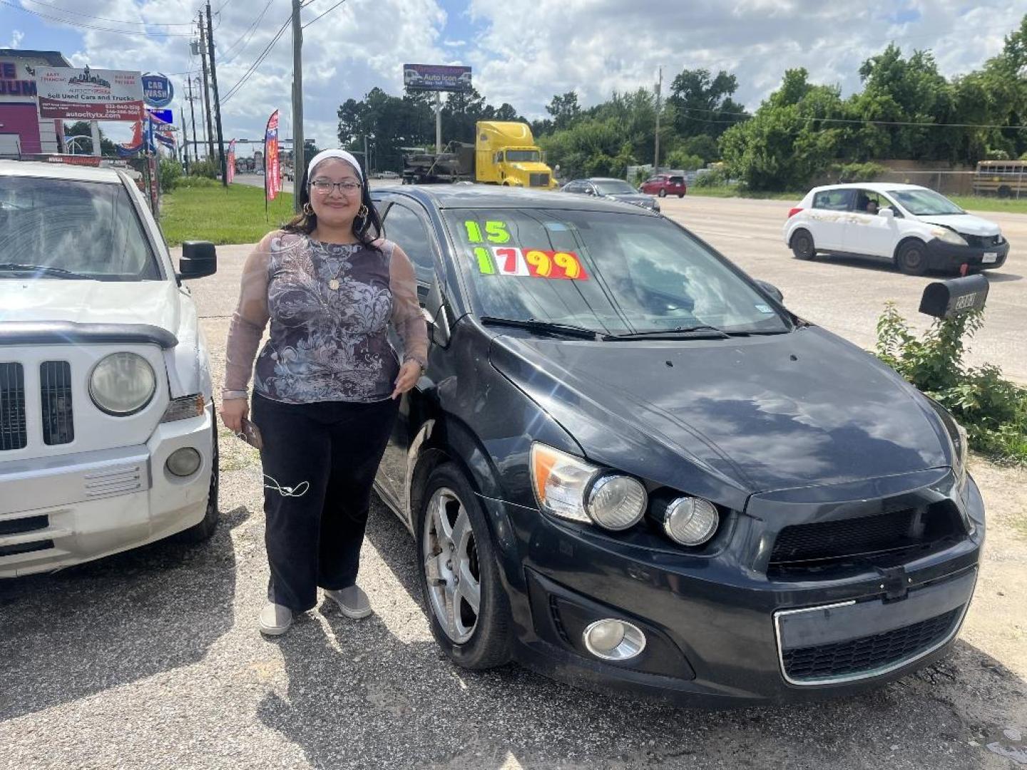 2015 BLACK CHEVROLET SONIC LTZ Auto Sedan (1G1JE5SBXF4) with an 1.4L L4 DOHC 24V TURBO engine, AUTOMATIC transmission, located at 2303 West Mt. Houston, Houston, 77038, (281) 507-3956, 29.771597, -95.339569 - Photo#0