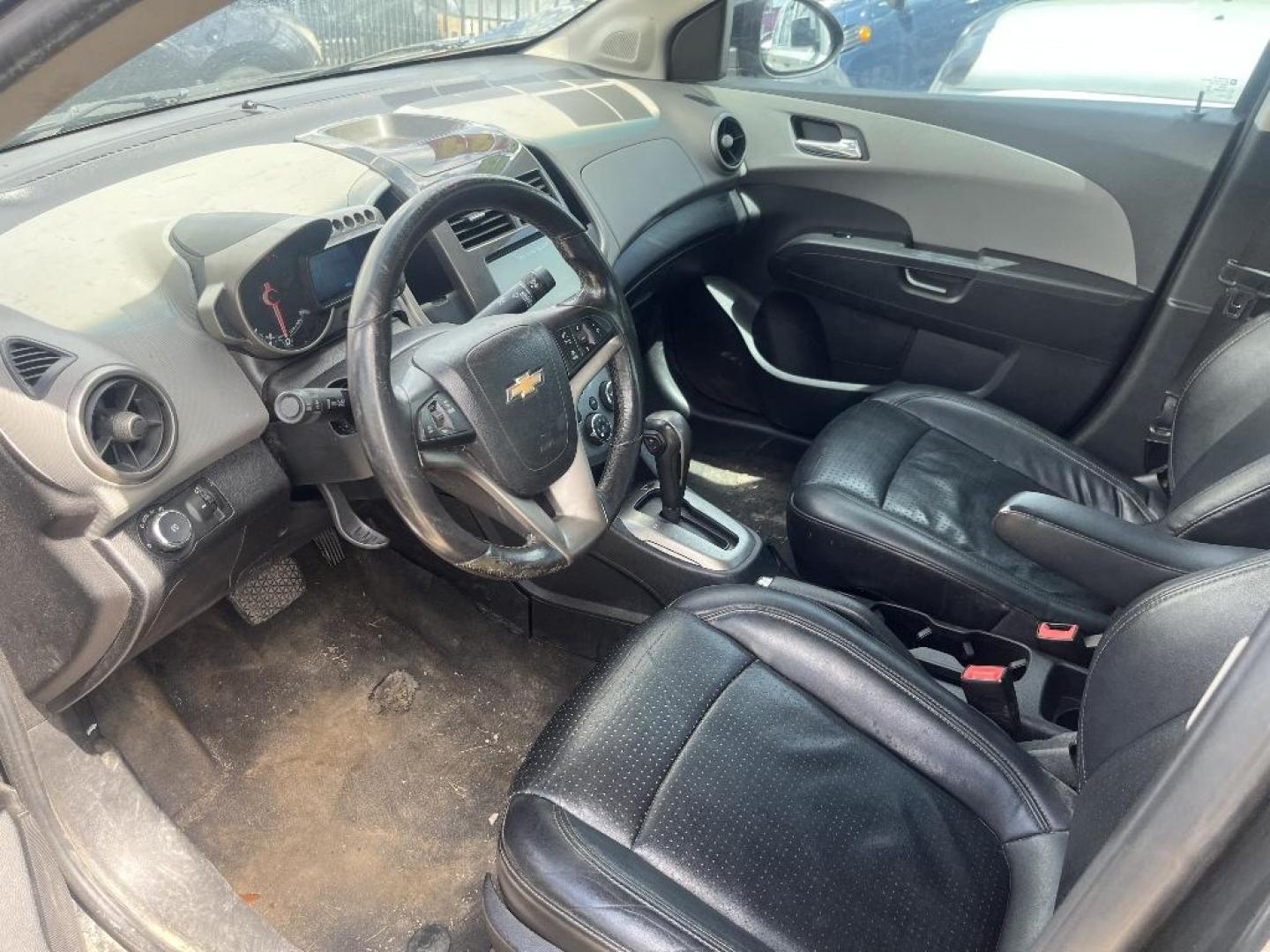 2015 BLACK CHEVROLET SONIC LTZ Auto Sedan (1G1JE5SBXF4) with an 1.4L L4 DOHC 24V TURBO engine, AUTOMATIC transmission, located at 2303 West Mt. Houston, Houston, 77038, (281) 507-3956, 29.771597, -95.339569 - Photo#1