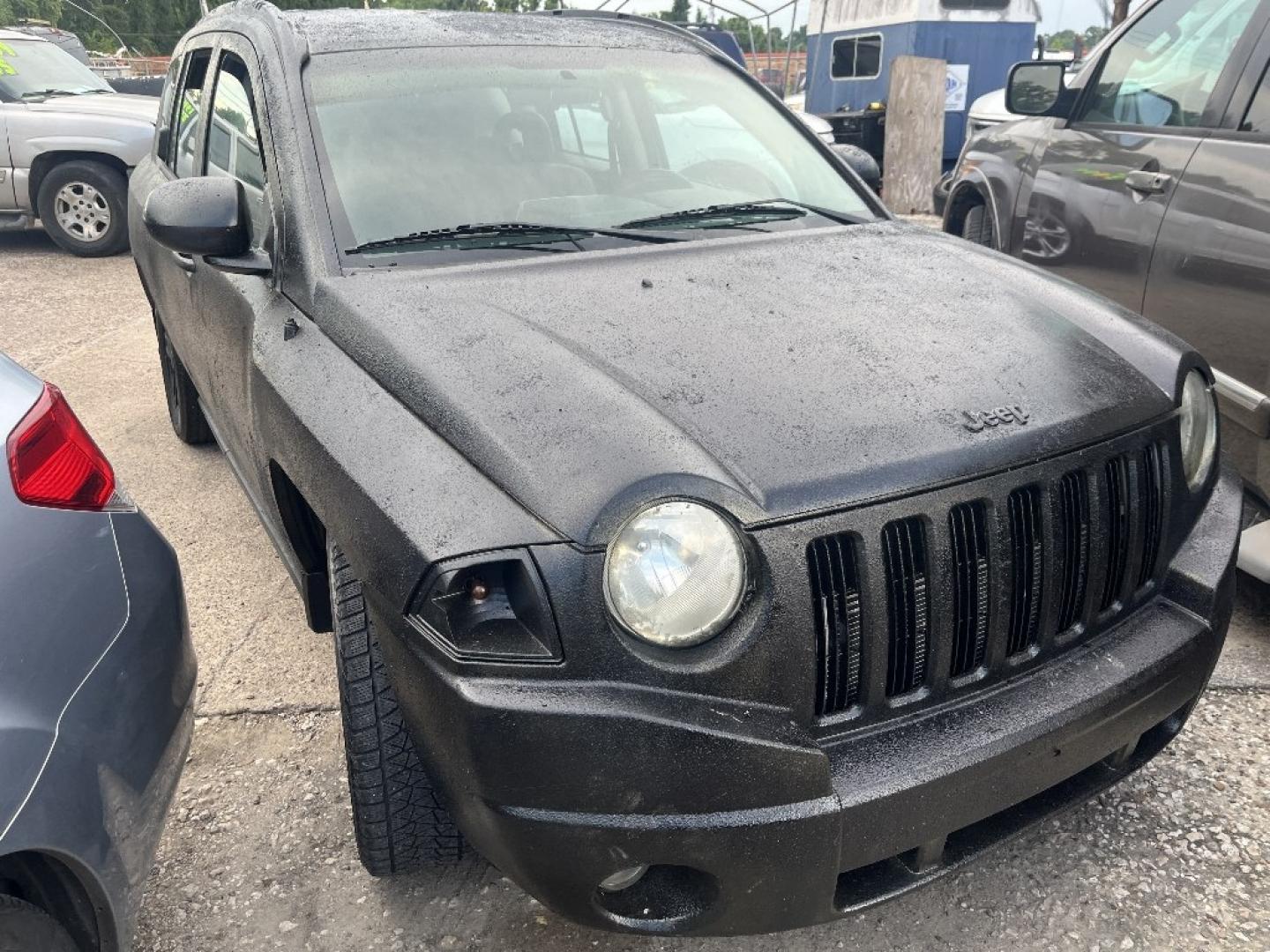 2007 BLACK JEEP COMPASS Sport 2WD (1J8FT47W97D) with an 2.4L L4 DOHC 16V engine, AUTOMATIC transmission, located at 2303 West Mt. Houston, Houston, 77038, (281) 507-3956, 29.771597, -95.339569- Photo#0