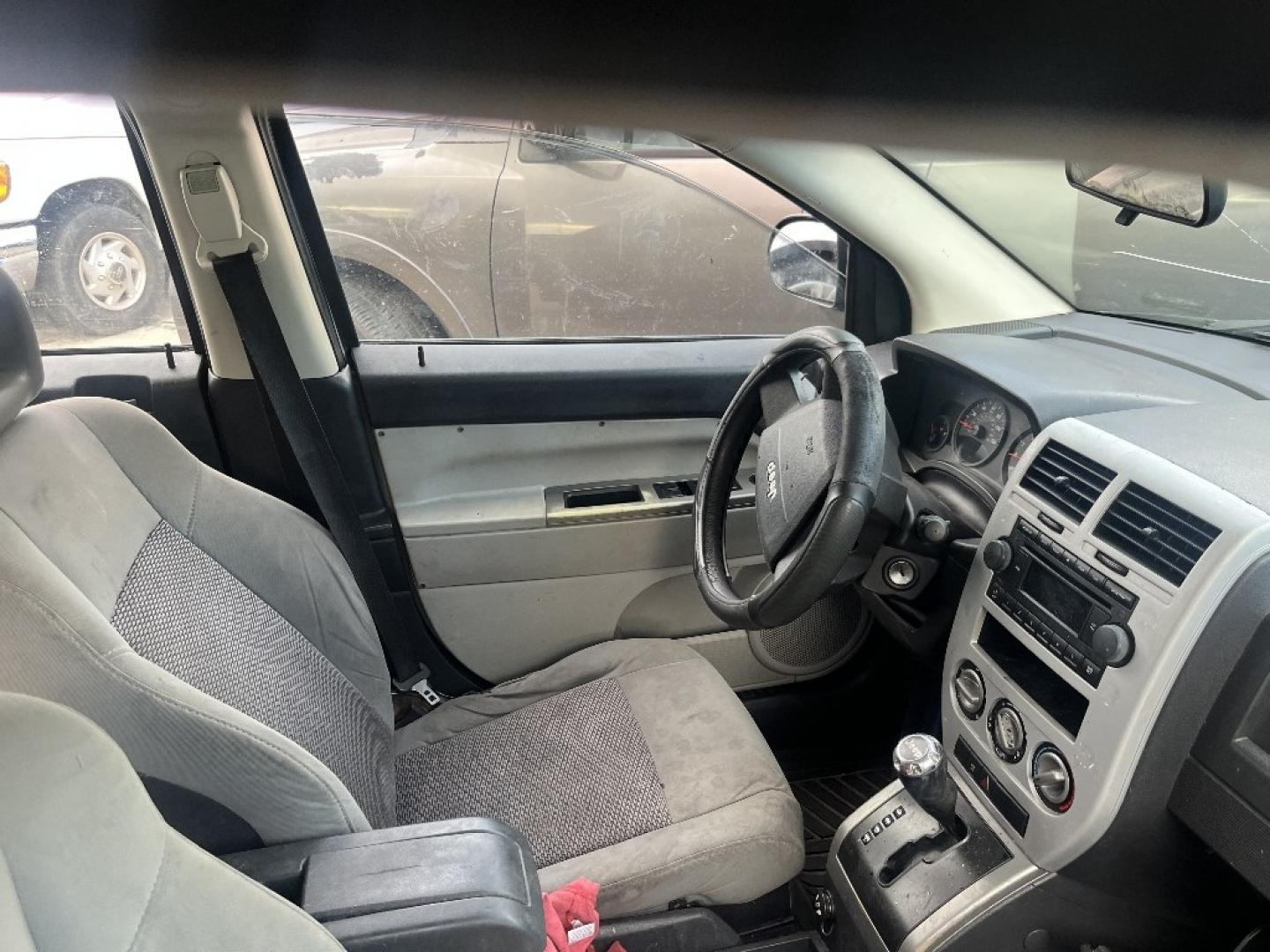 2007 BLACK JEEP COMPASS Sport 2WD (1J8FT47W97D) with an 2.4L L4 DOHC 16V engine, AUTOMATIC transmission, located at 2303 West Mt. Houston, Houston, 77038, (281) 507-3956, 29.771597, -95.339569- Photo#1