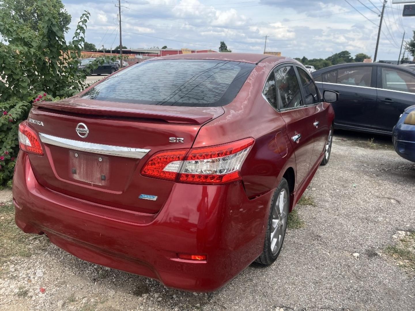 2014 RED /BLACK NISSAN SENTRA S 6MT (3N1AB7AP7EY) with an 1.8L L4 SFI DOHC 16V engine, AUTOMATIC transmission, located at 2303 West Mt. Houston, Houston, 77038, (281) 507-3956, 29.771597, -95.339569- Photo#2