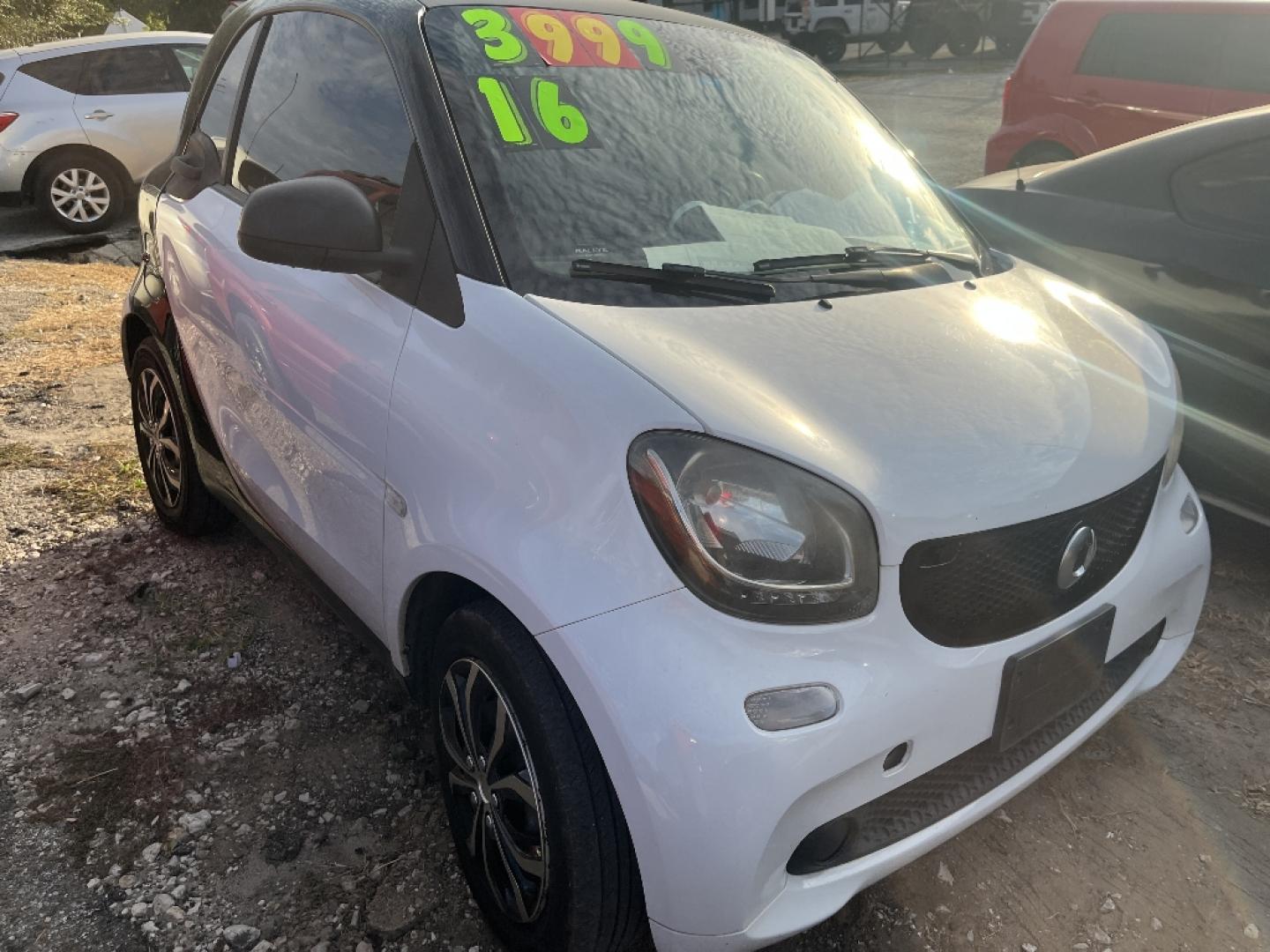 2016 WHITE /BLACK SMART FORTWO passion coupe (WMEFJ5DA4GK) with an 1.0L L3 DOHC 12V engine, AUTOMATIC transmission, located at 2303 West Mt. Houston, Houston, 77038, (281) 507-3956, 29.771597, -95.339569- Photo#2