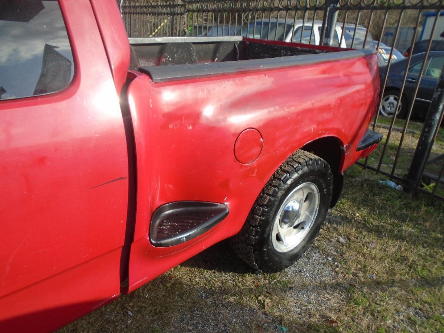 2000 RED FORD F-150 XL SuperCab Flareside 2WD (1FTZX0724YK) with an 4.2L V6 OHV 12V engine, AUTOMATIC transmission, located at 2303 West Mt. Houston, Houston, 77038, (281) 507-3956, 29.771597, -95.339569- Photo#2