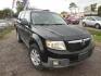 2008 BLACK MAZDA TRIBUTE s Grand Touring FWD (4F2CZ06128K) with an 3.0L V6 DOHC 24V engine, AUTOMATIC transmission, located at 2303 West Mt. Houston, Houston, 77038, (281) 507-3956, 29.771597, -95.339569- Photo#0