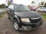 2008 BLACK MAZDA TRIBUTE s Grand Touring FWD (4F2CZ06128K) with an 3.0L V6 DOHC 24V engine, AUTOMATIC transmission, located at 2303 West Mt. Houston, Houston, 77038, (281) 507-3956, 29.771597, -95.339569 - Photo#0