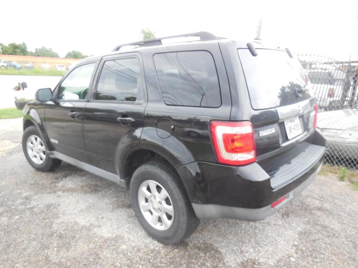 2008 BLACK MAZDA TRIBUTE s Grand Touring FWD (4F2CZ06128K) with an 3.0L V6 DOHC 24V engine, AUTOMATIC transmission, located at 2303 West Mt. Houston, Houston, 77038, (281) 507-3956, 29.771597, -95.339569 - Photo#1