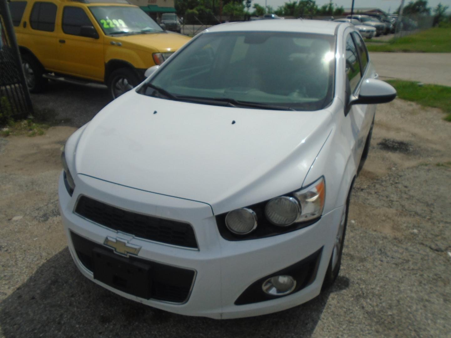 2012 WHITE CHEVROLET SONIC 2LT Sedan (1G1JC5SH9C4) with an 1.8L L4 DOHC 24V engine, AUTOMATIC transmission, located at 2303 West Mt. Houston, Houston, 77038, (281) 507-3956, 29.771597, -95.339569- Photo#1