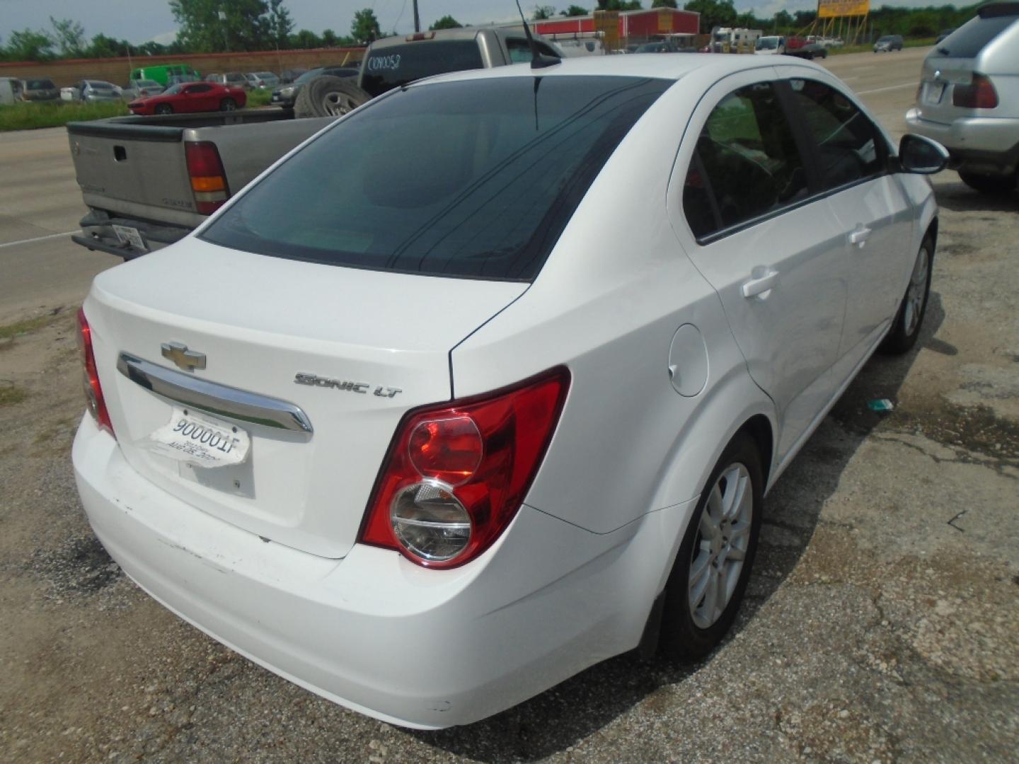 2012 WHITE CHEVROLET SONIC 2LT Sedan (1G1JC5SH9C4) with an 1.8L L4 DOHC 24V engine, AUTOMATIC transmission, located at 2303 West Mt. Houston, Houston, 77038, (281) 507-3956, 29.771597, -95.339569- Photo#3